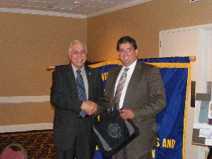 Stephen Makrinos (l), chapter president, gives guest speaker Gary Blohm, Future Combat Systems, a commemorative gift from the chapter in thanks for his October presentation.

